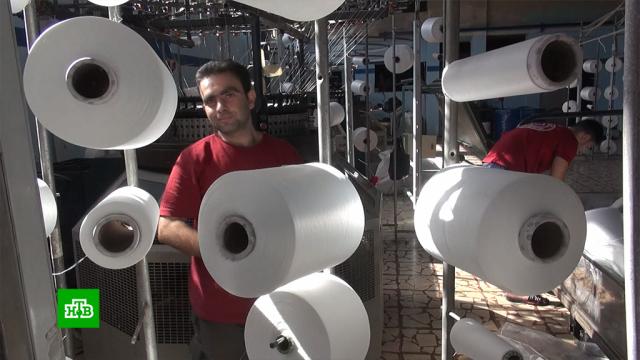 Разрушенная войной швейная фабрика в сирийском Алеппо возобновила работу.Сирия, войны и вооруженные конфликты, заводы и фабрики.НТВ.Ru: новости, видео, программы телеканала НТВ